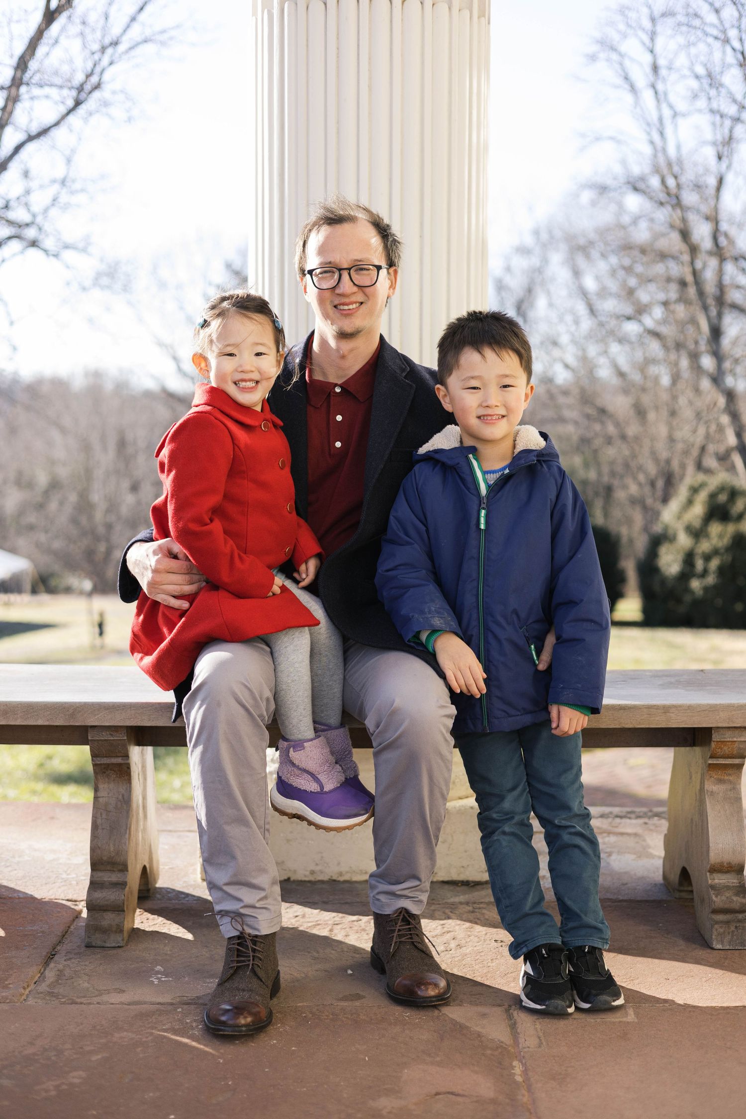 Three candid photos show a heartwarming moment between an adult and two children sitting together on a bench outdoors.