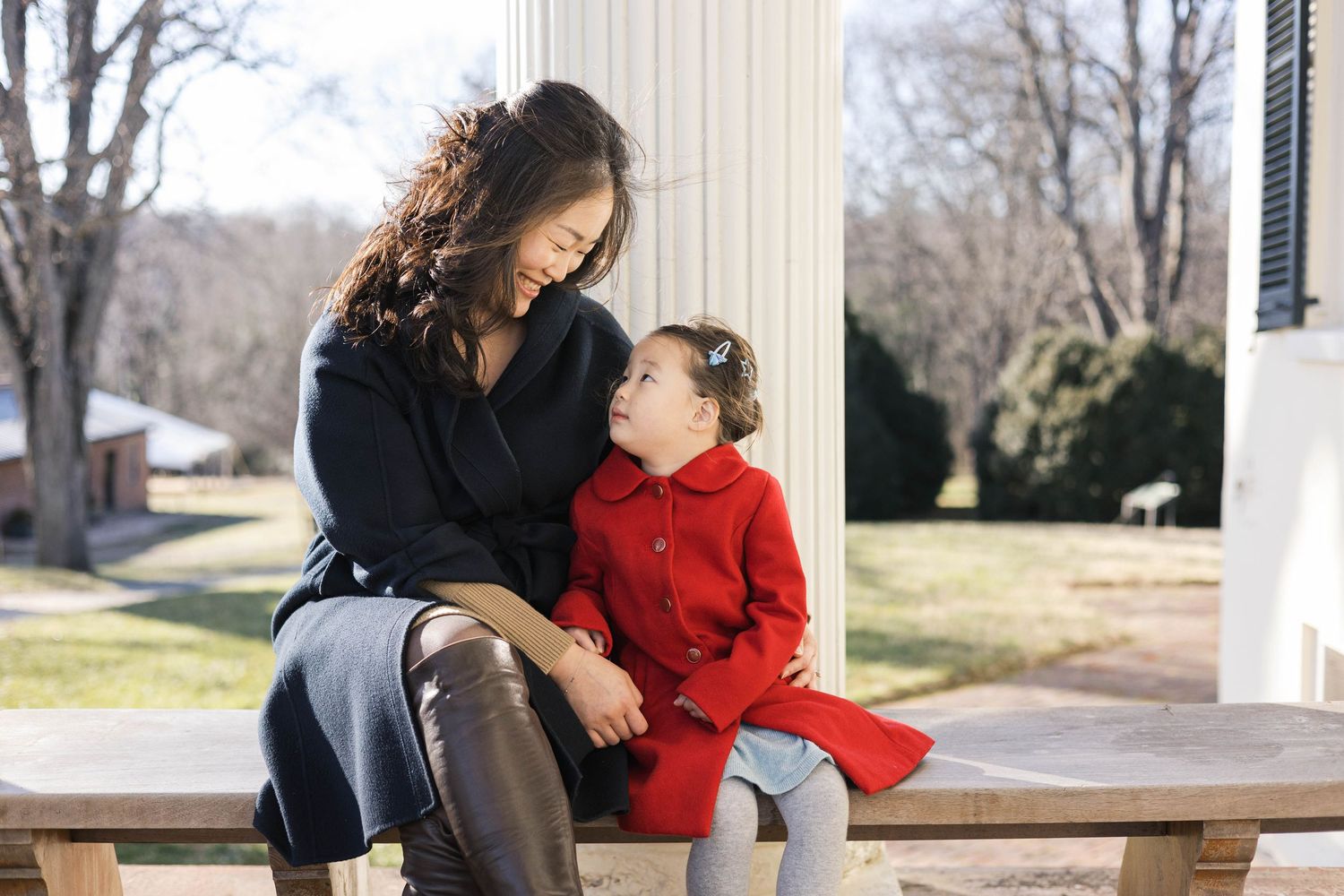 A collection of outdoor family photos showing people sitting on a porch and walking together in nature.