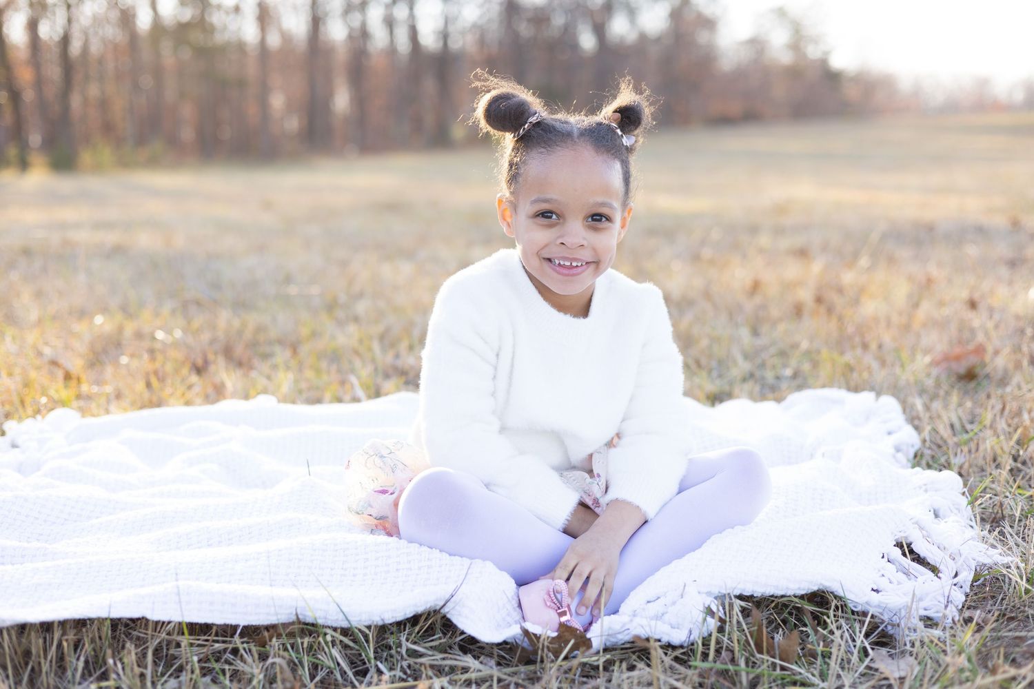 Intimate family photoshoot in outdoor setting with natural lighting.
