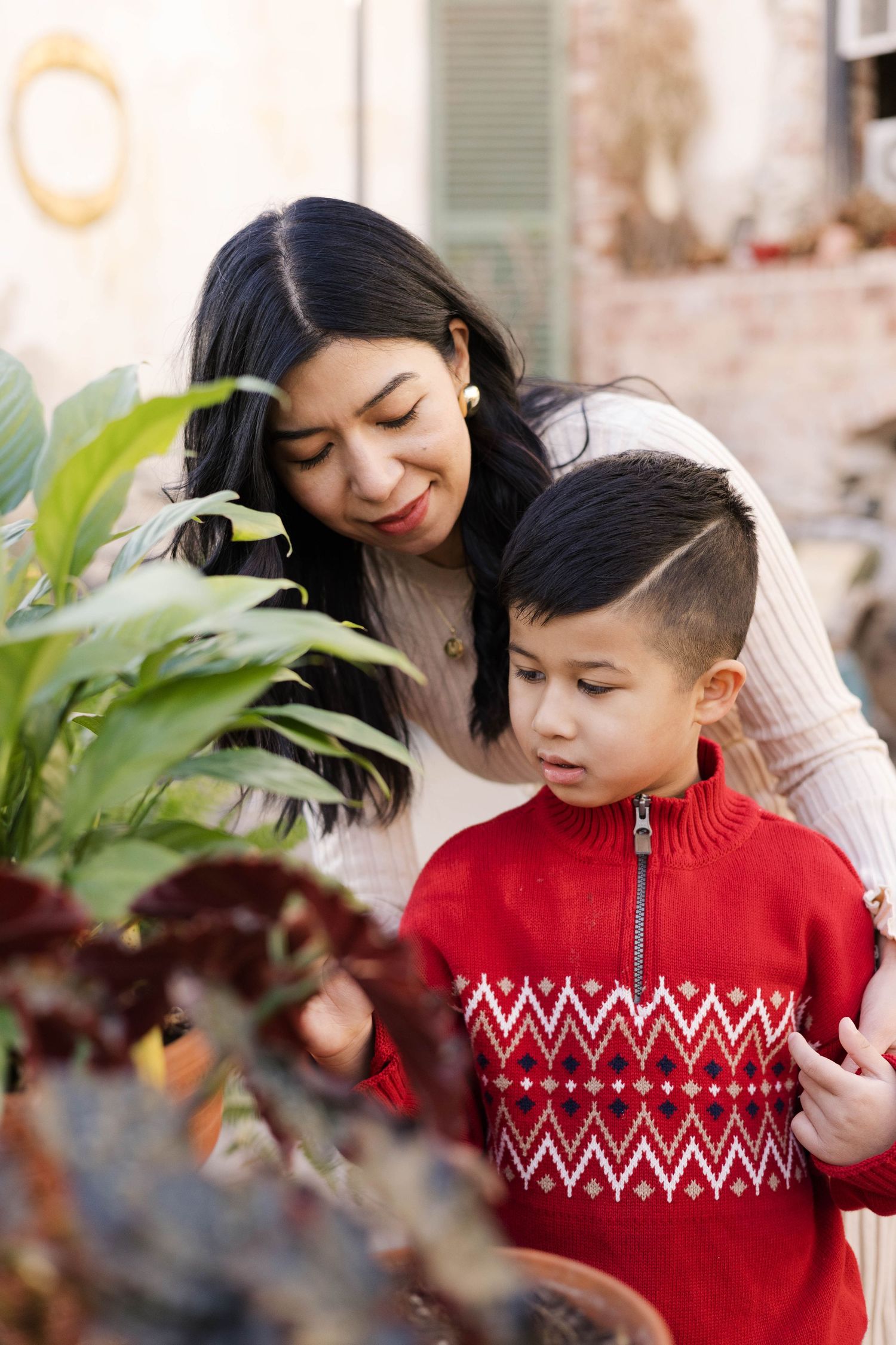Close-up shots of a family sharing tender moments against a festive winter backdrop.
