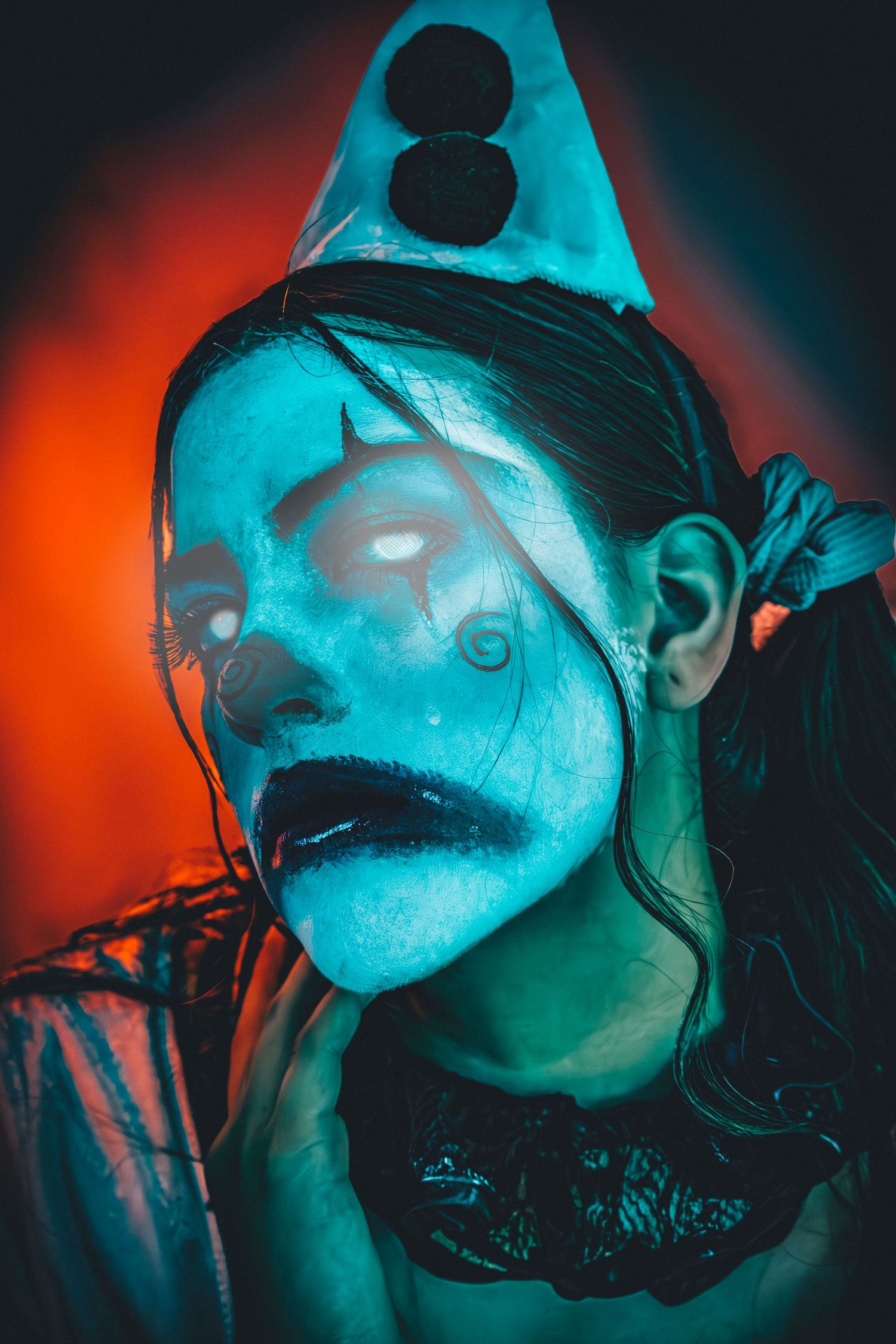 Moody portrait sequence with cyan and orange lighting creating an ethereal underwater effect.