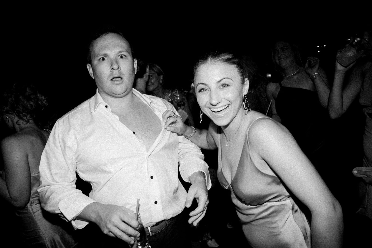 Black and white photos of wedding guests dancing at reception.