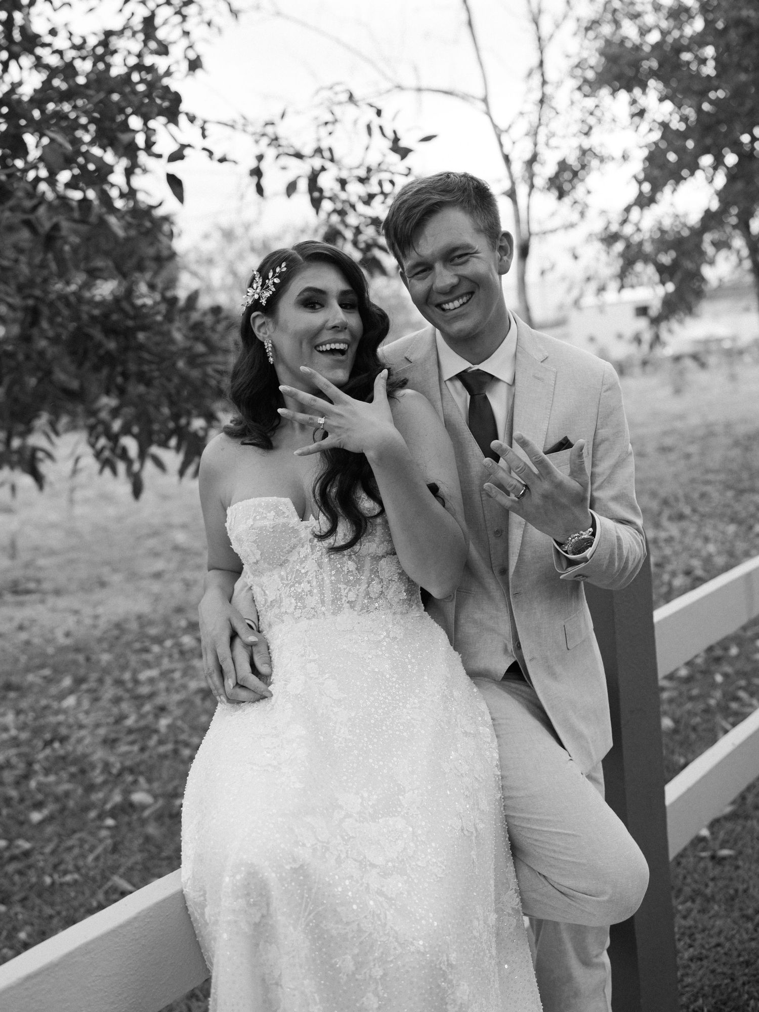 Black and white wedding photos capture joyful moments between newlyweds.