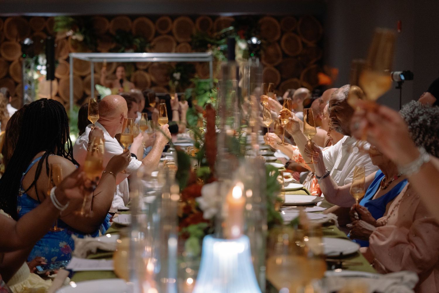 Wedding reception dinner tables with guests enjoying the celebration.