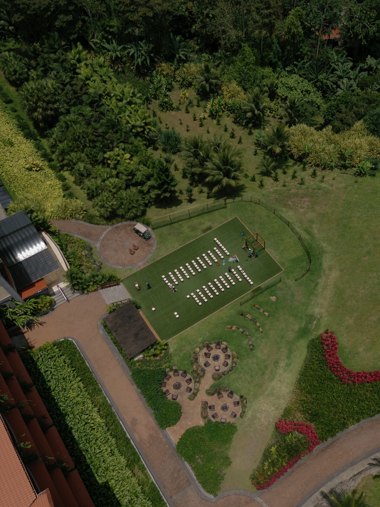 Aerial view of a manicured garden with flower beds and walking paths.