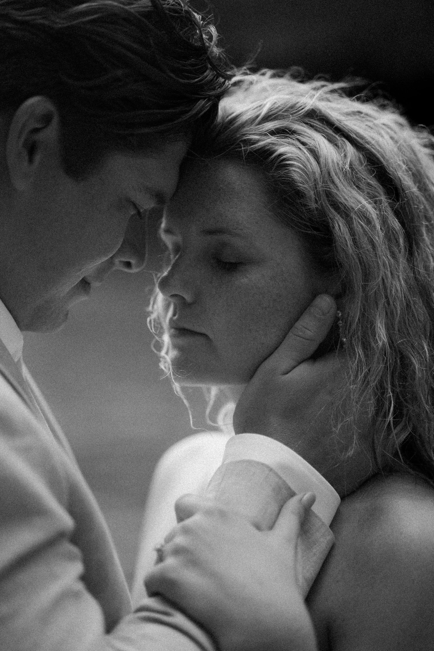 Intimate black and white close-up shots of a romantic moment.