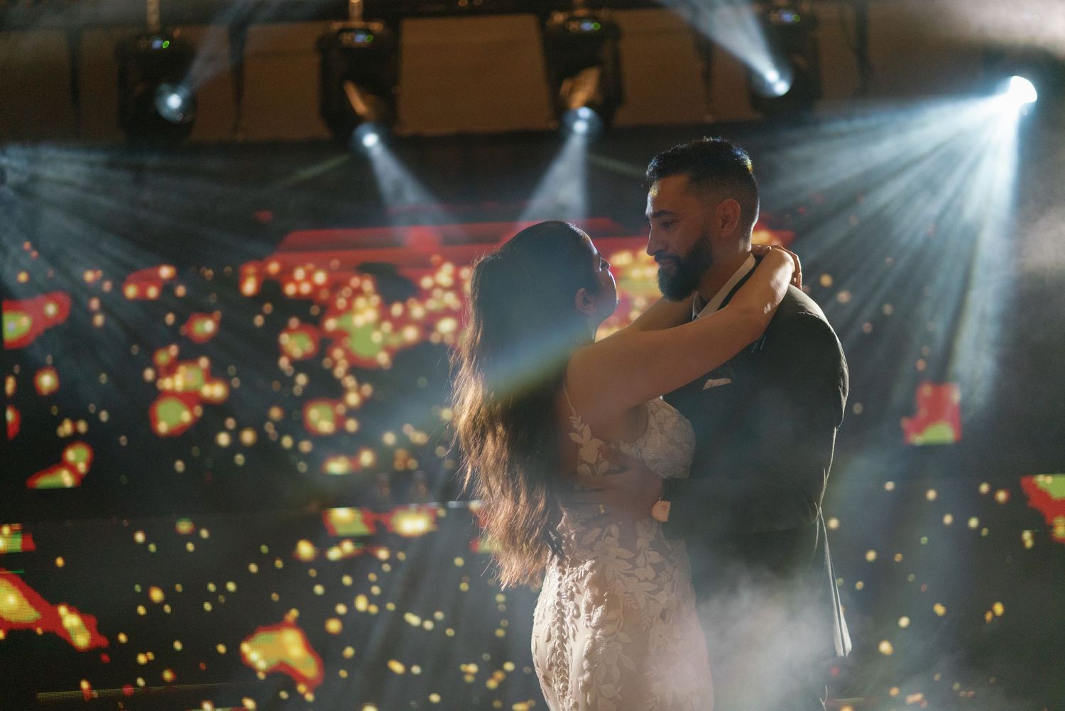 Romantic dance scene with dramatic lighting and floating sparkle effects.