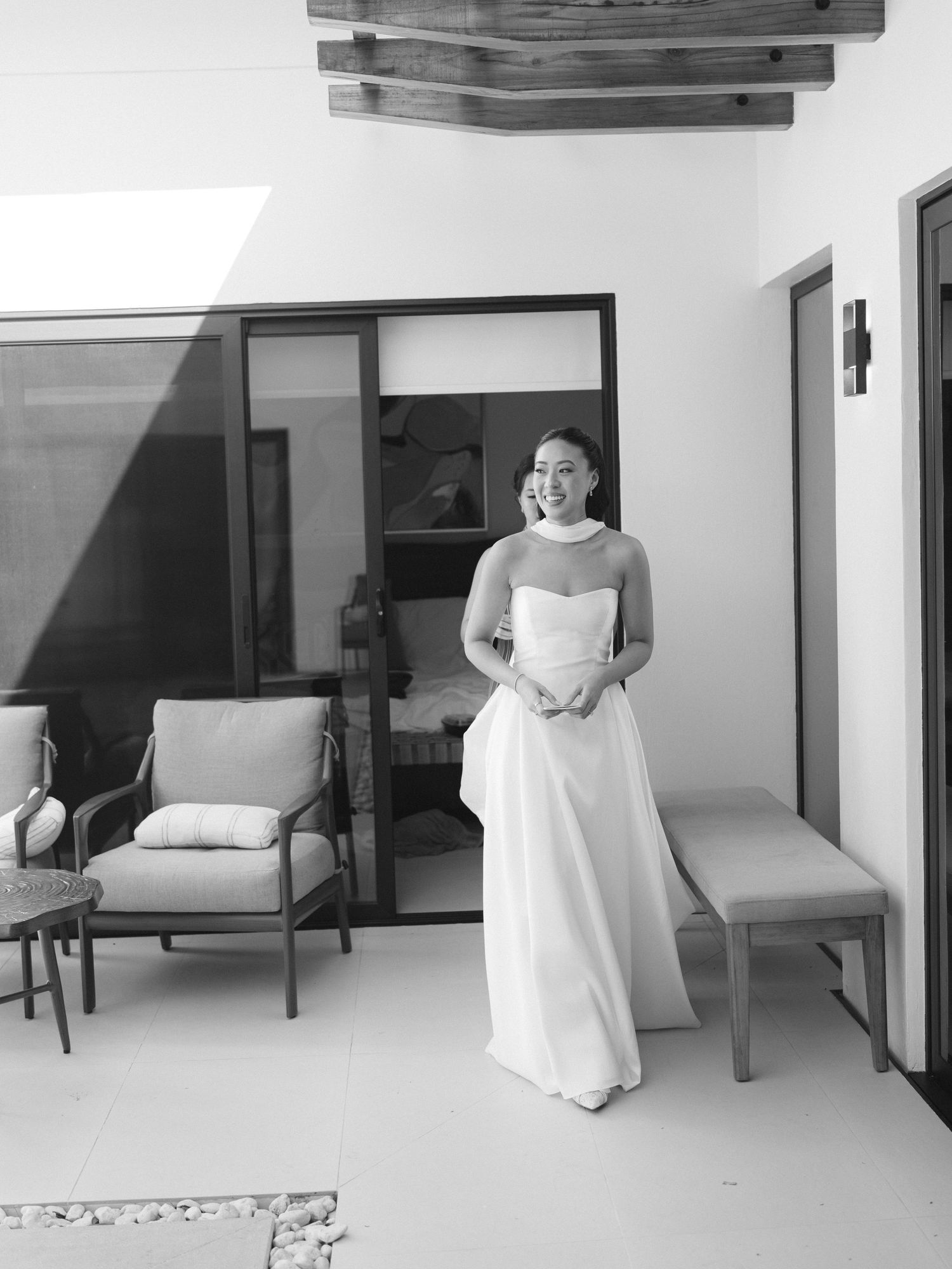 Minimalist black and white interior shots showing wedding preparations in a modern room.