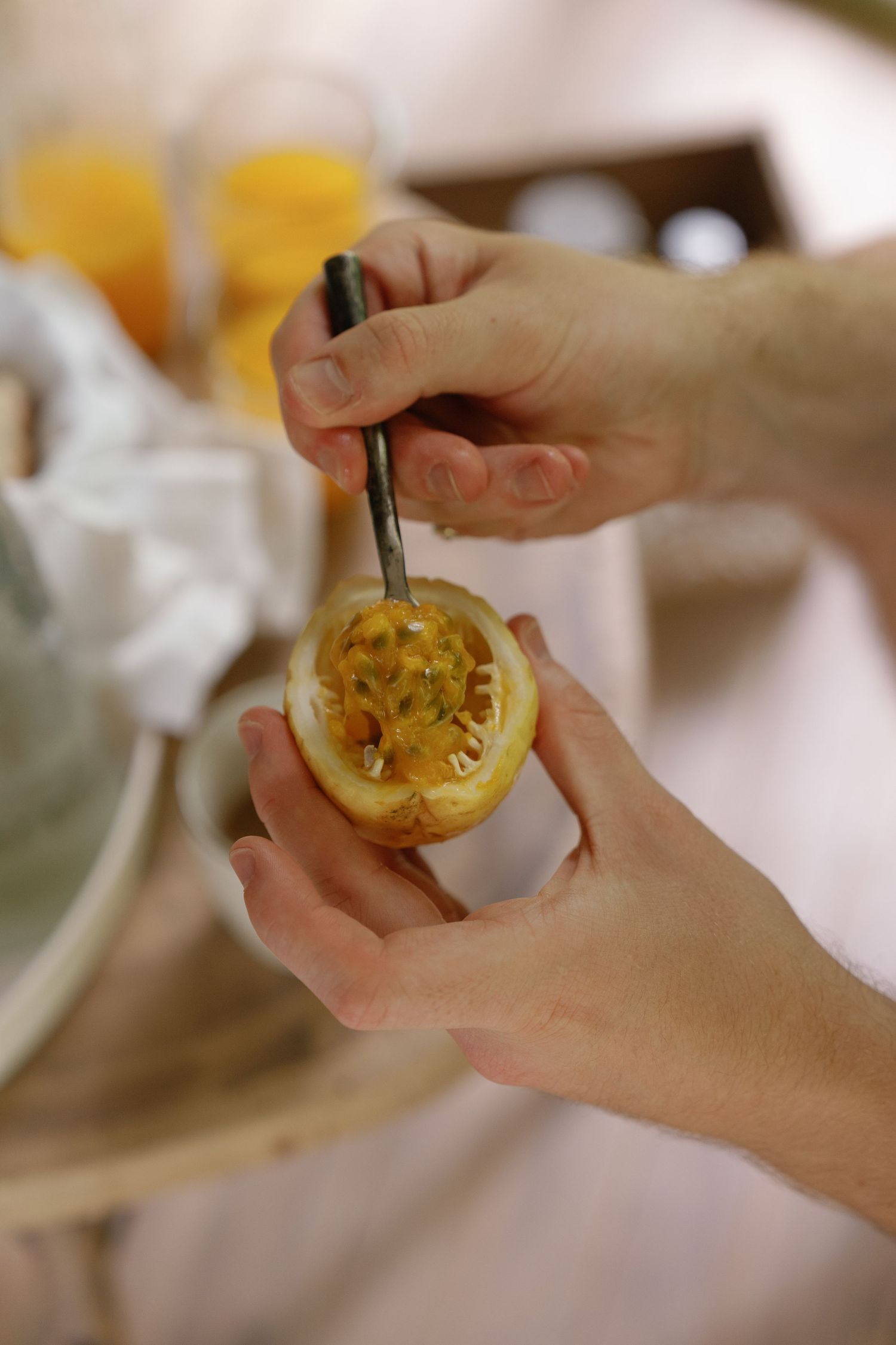 Hands preparing garnished citrus fruits for wedding cocktails.