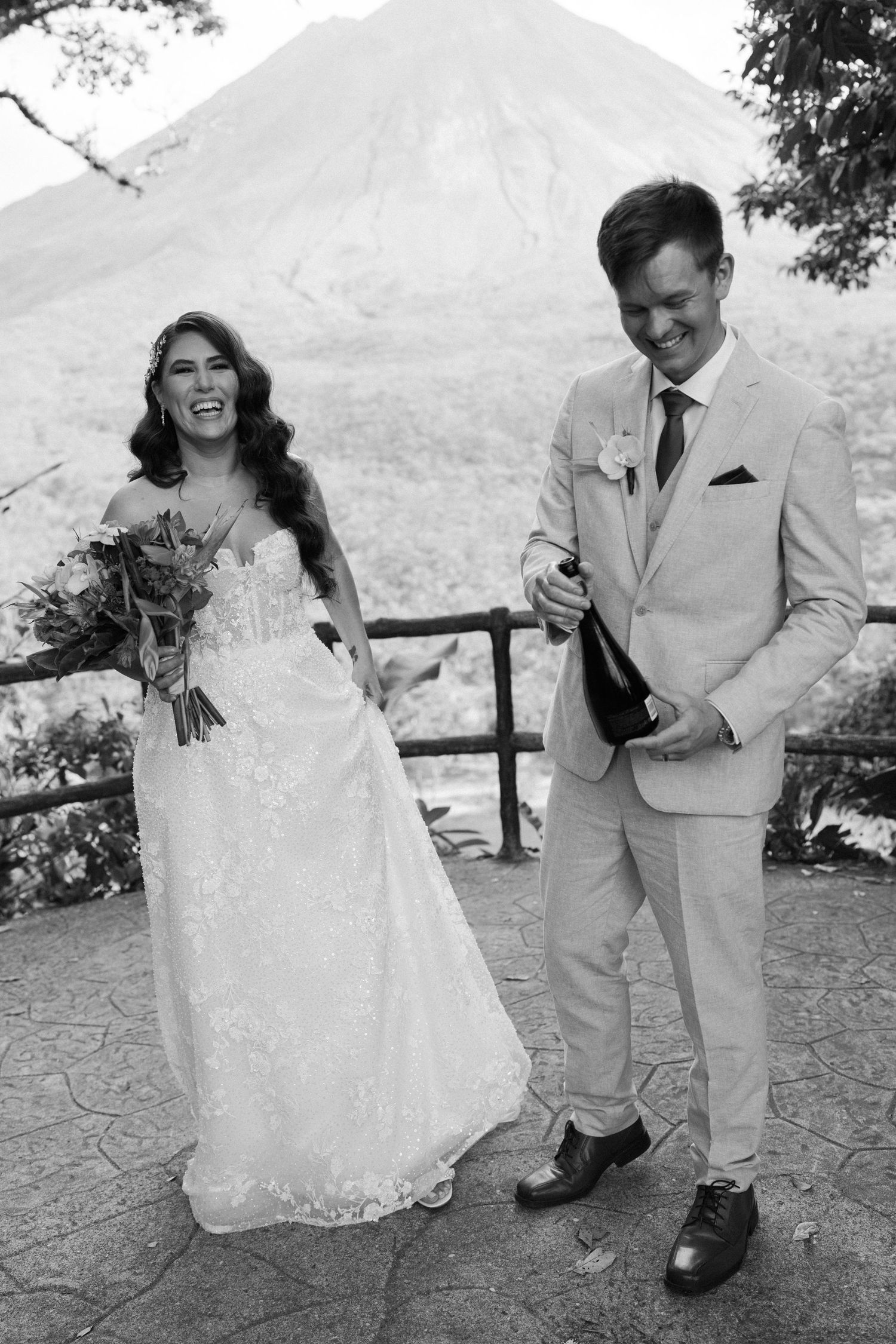 Candid wedding photo sequence showing playful moments on mountain overlook.