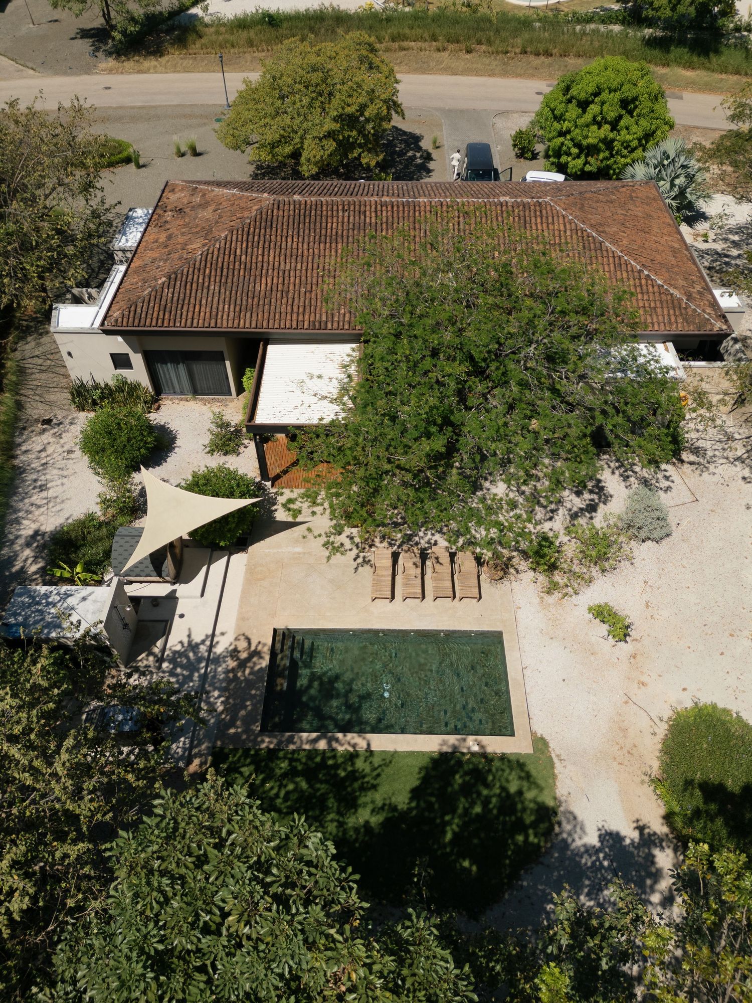 Aerial view of a Mediterranean-style venue with tiled roofs and landscaped grounds.