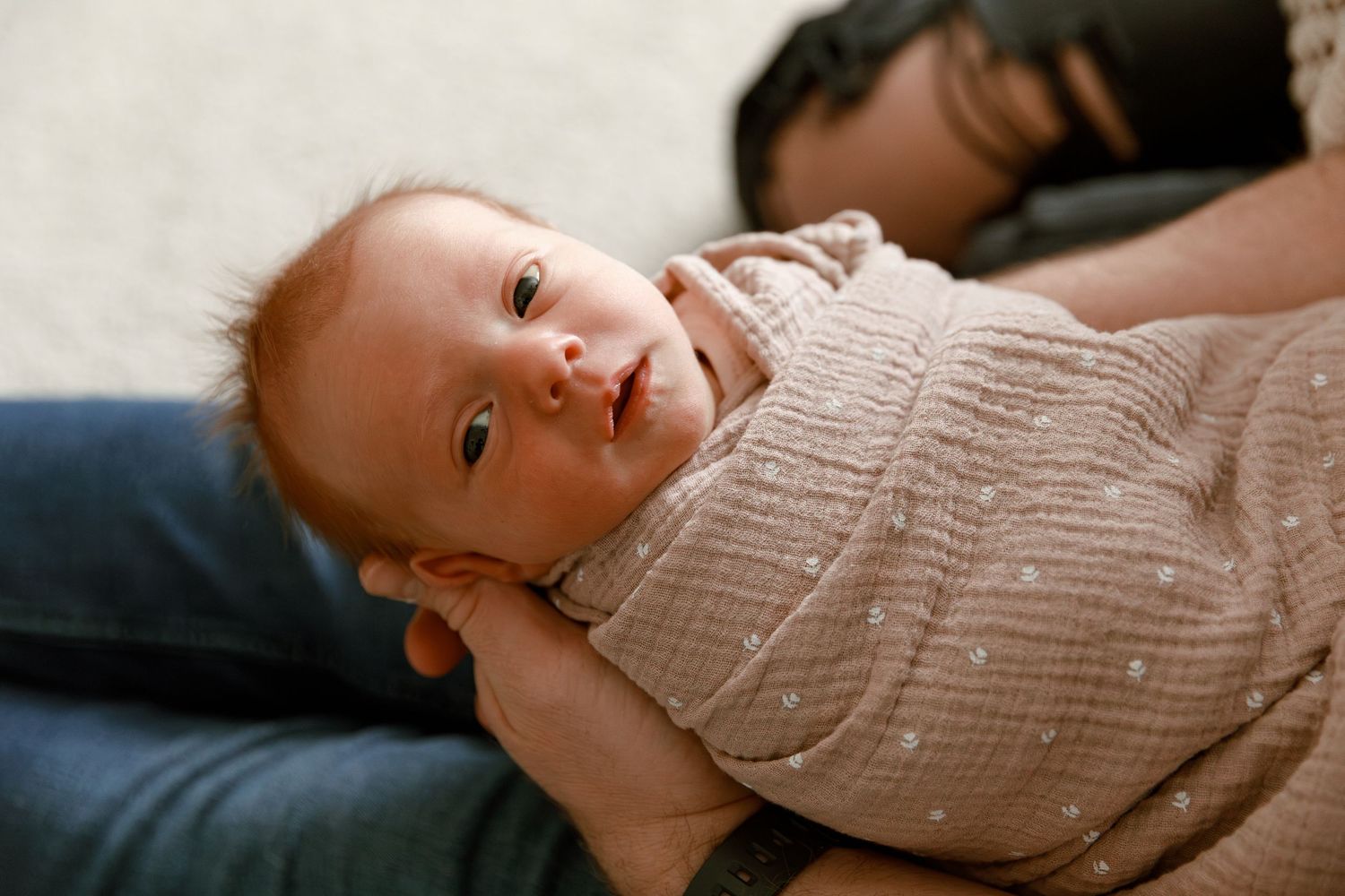 A series of soft focus baby portraits in natural light showing tender moments.