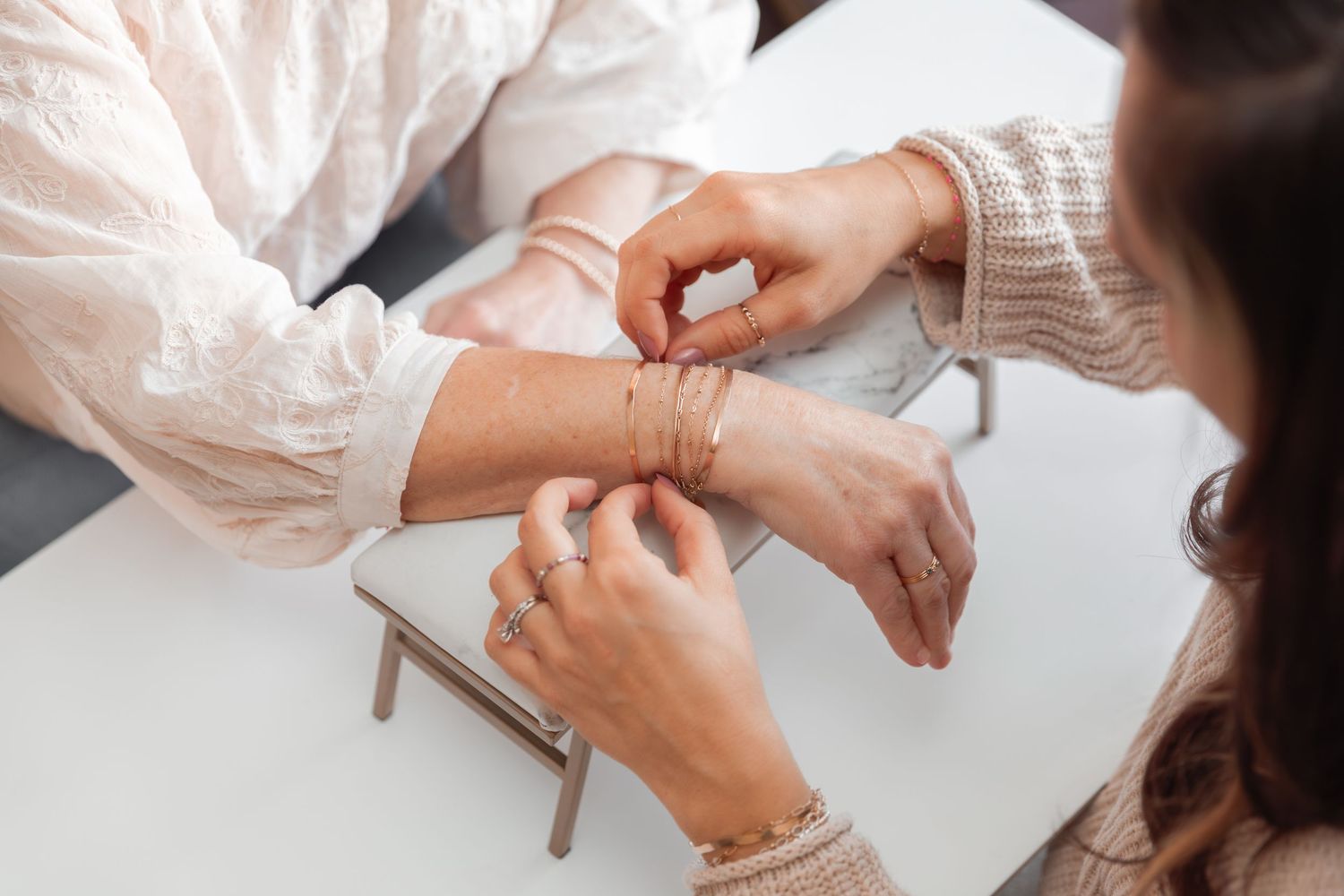 Close-up view of hands performing a medical procedure with white gloves and sterile equipment.