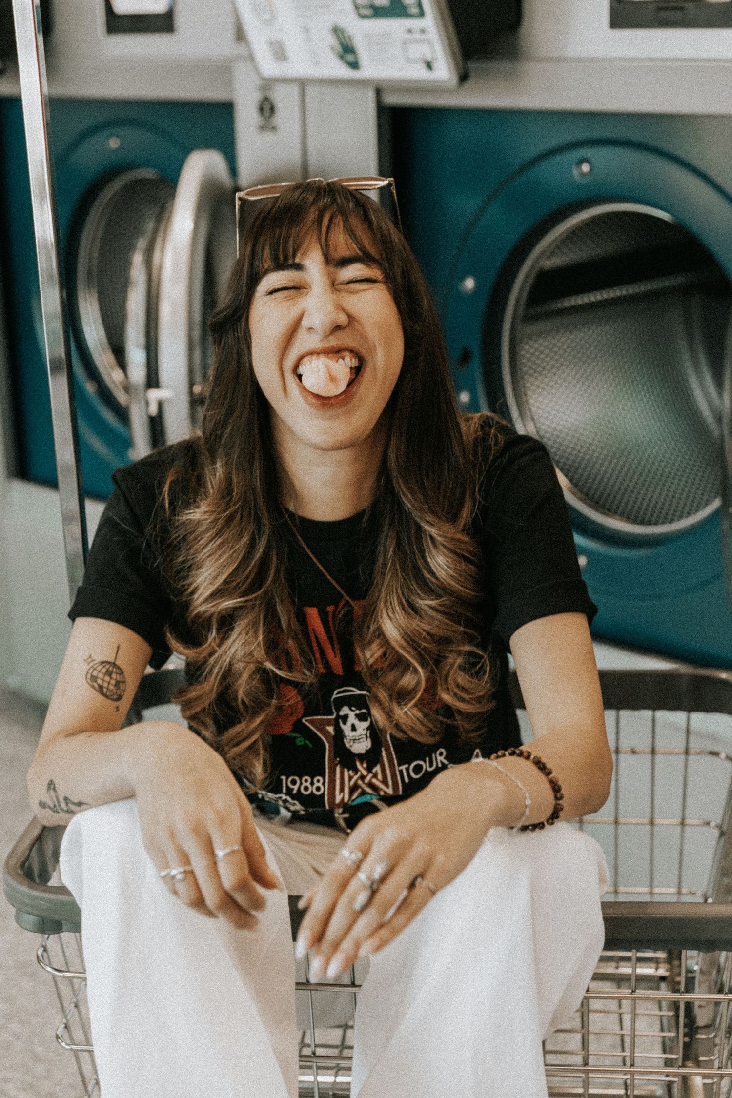 Candid shots at a laundromat showing joyful expressions.