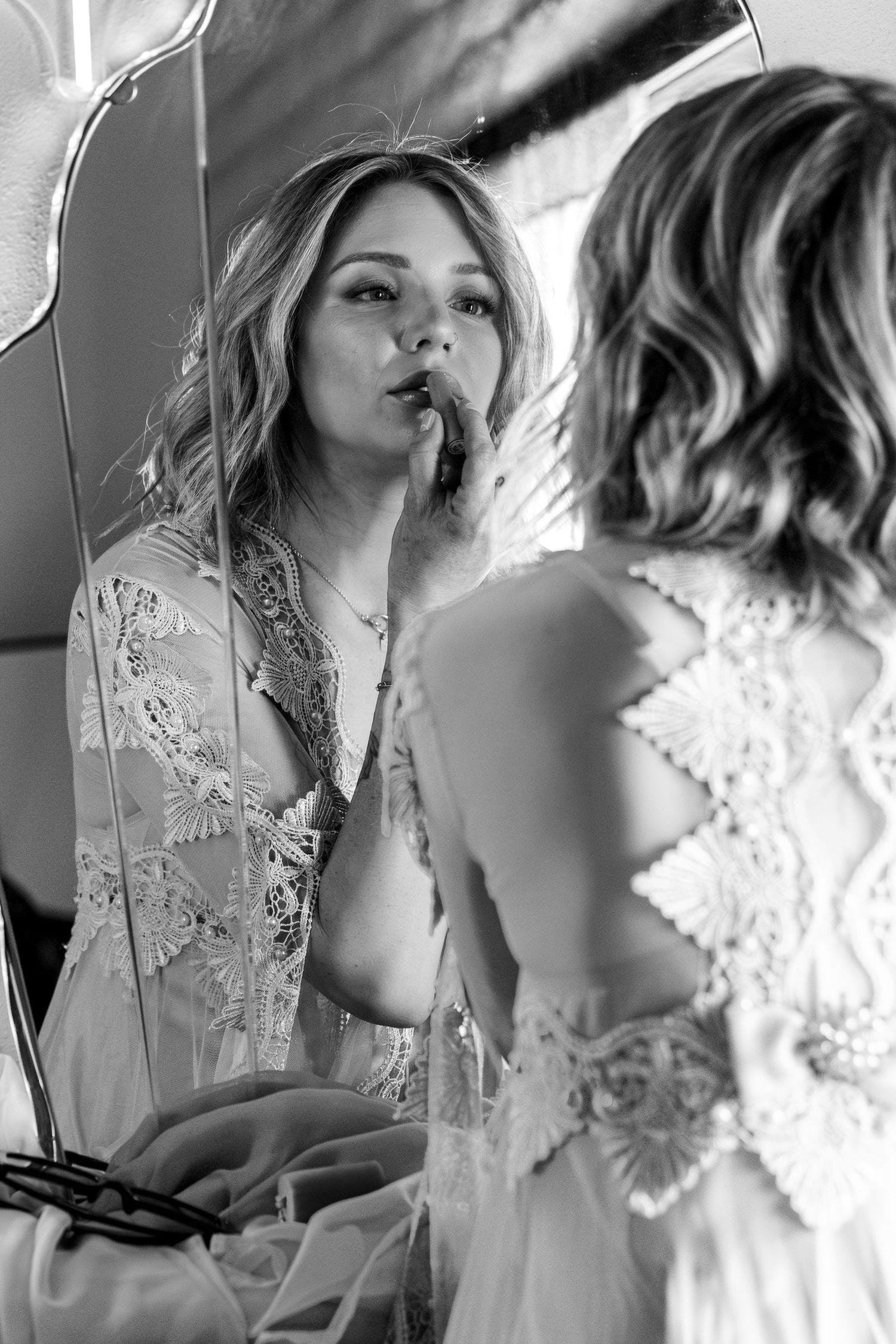 Ethereal black and white photos showing intricate lace details in romantic lighting.