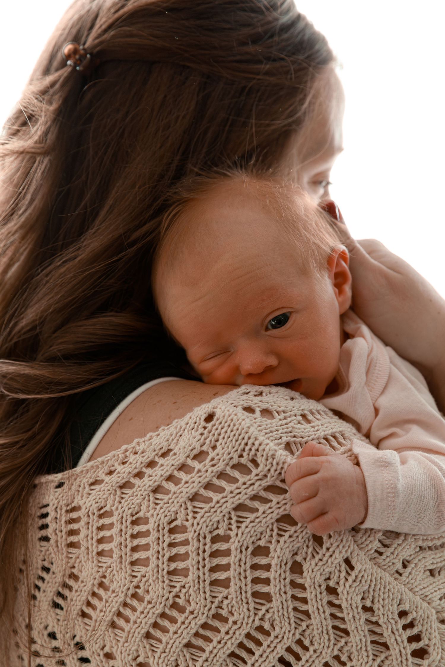 Close-up of knit sweater texture with soft natural lighting.
