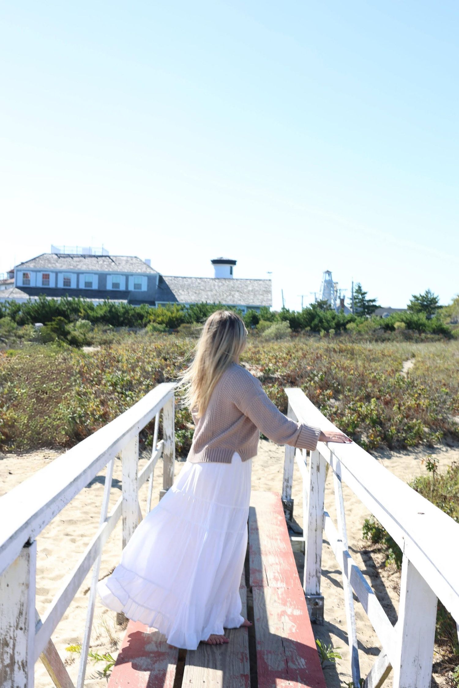 photo of girl looking into the distance on the beach