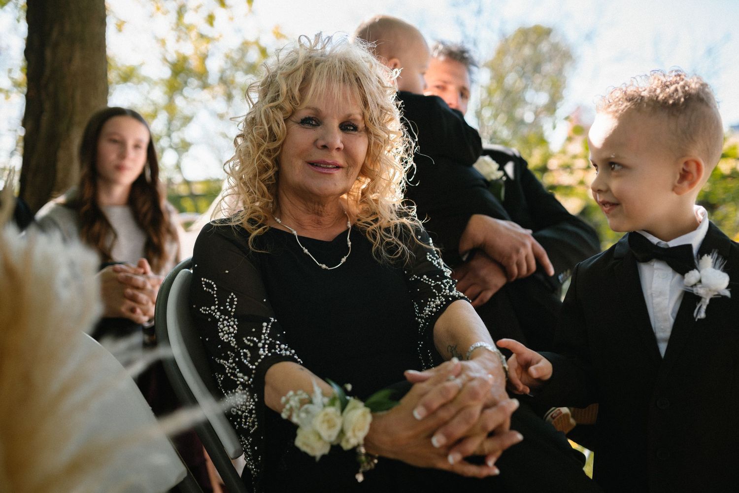 Candid moments captured during an autumn wedding ceremony with guests.
