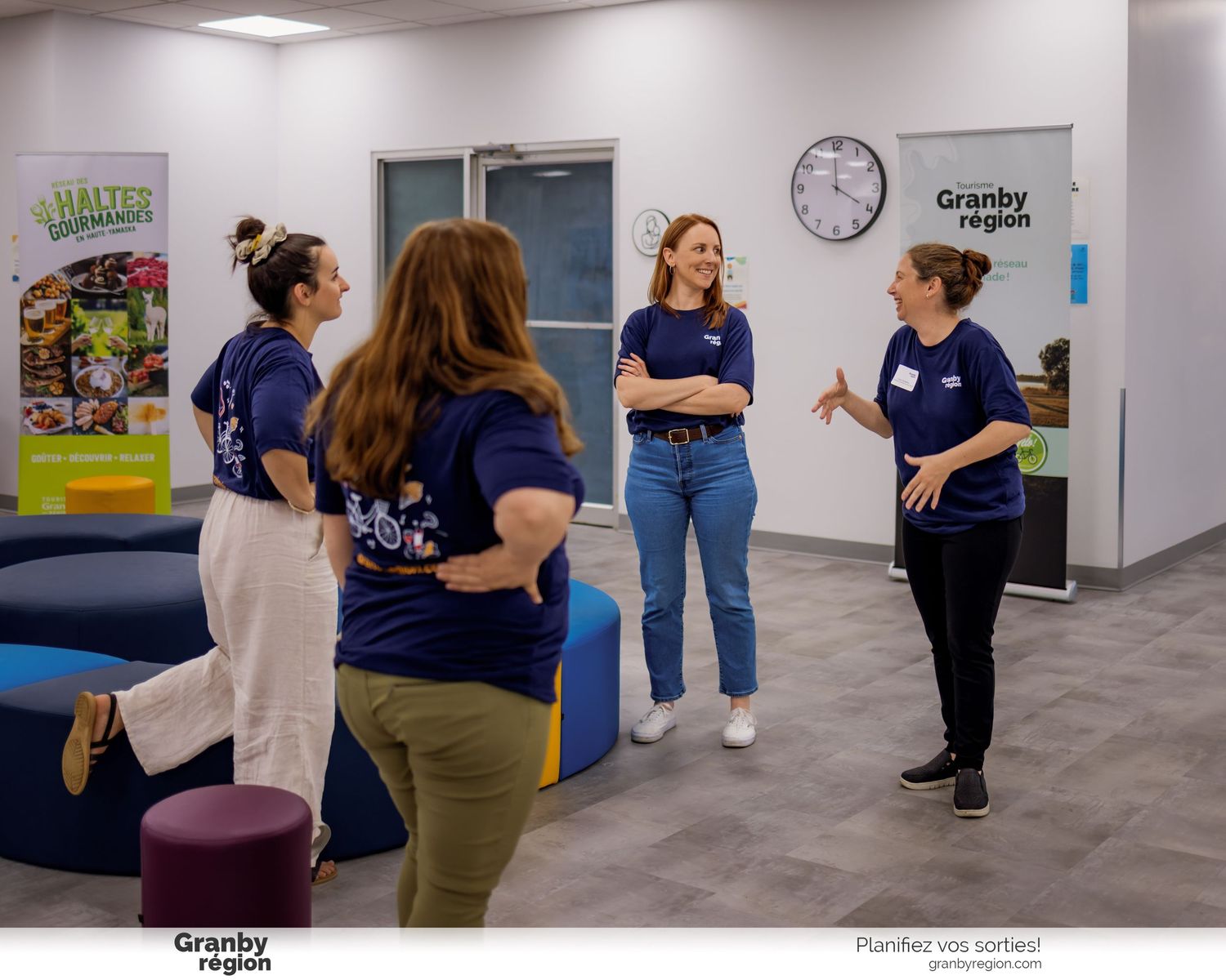 Group activity session taking place in a well-lit indoor space with purple seating.
