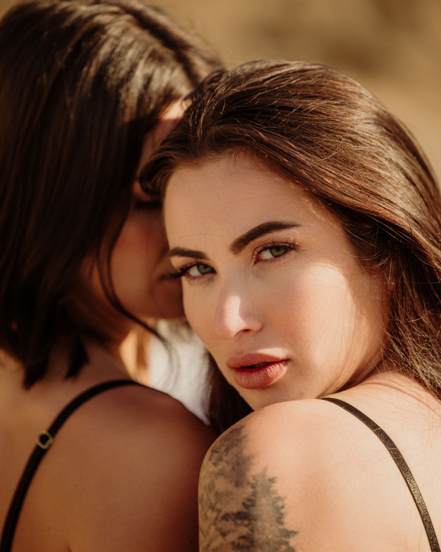 Artistic close-up portrait series showing tattoos and intimate details.