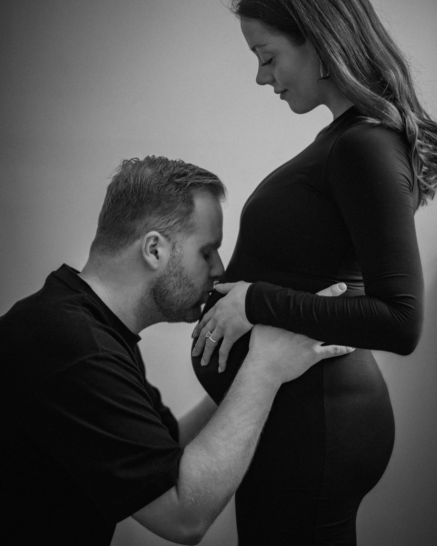 Black and white intimate maternity photos showing tender moments.