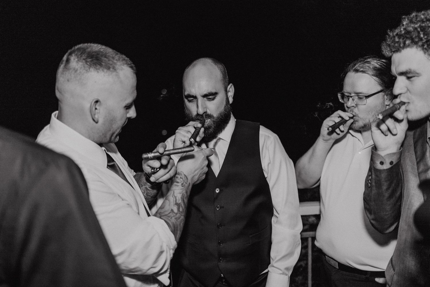 Black and white sequence of celebratory moments at a wedding reception.