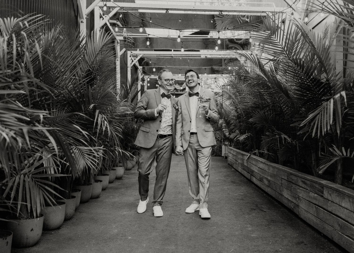 Black and white photo series of a couple in a greenhouse setting with tropical plants.