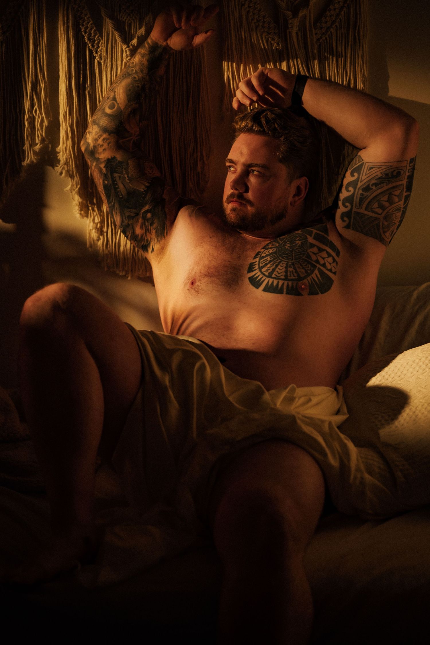 Artistic boudoir photo sequence showing reclining figure in warm ambient lighting.