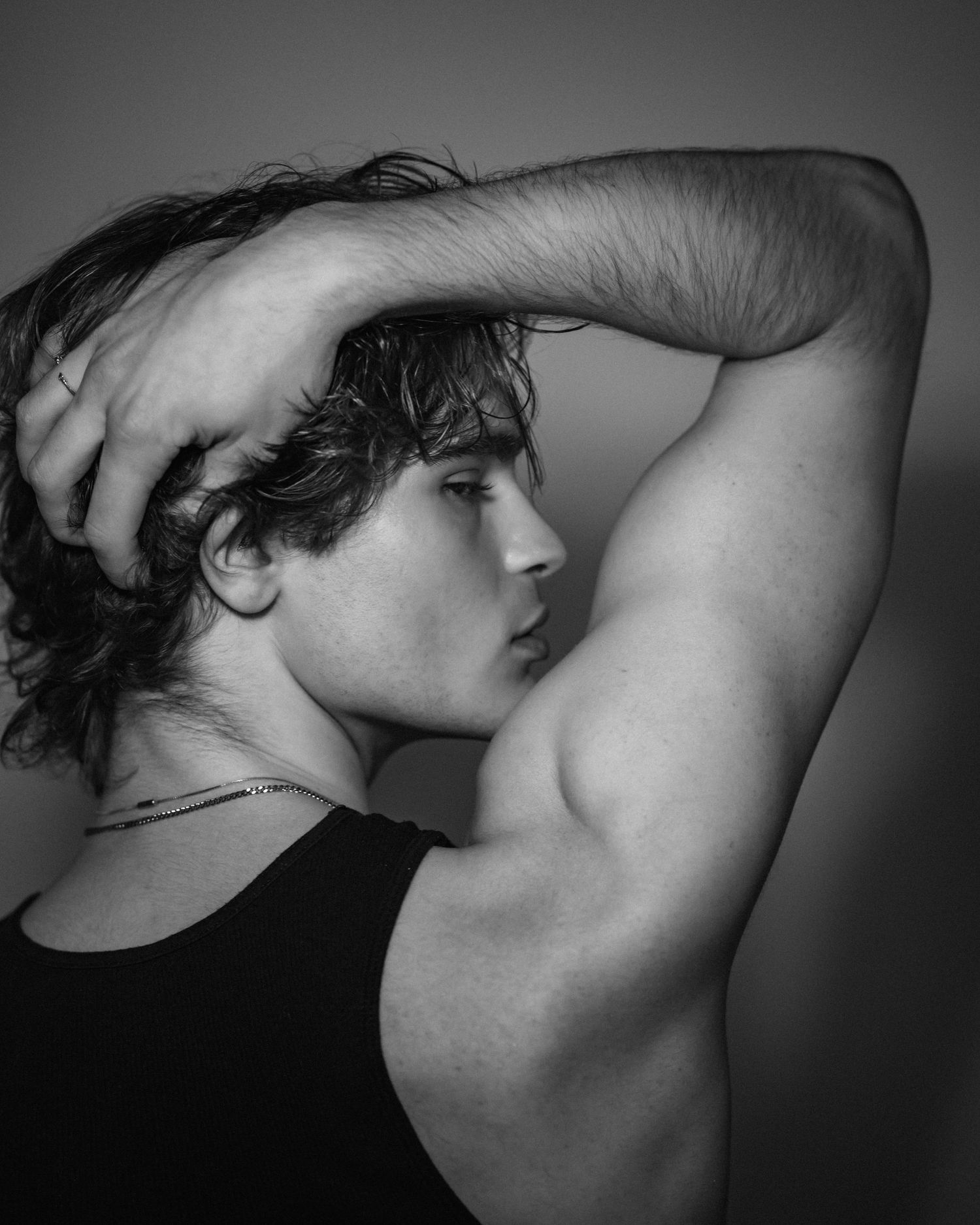 Artistic black and white portraits showcasing muscular form and movement.