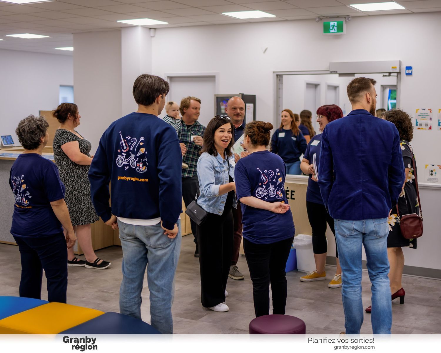People engaging in interactive group activities in a bright indoor training space.