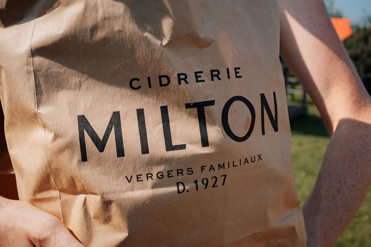 Close-up of vintage-style branding text on natural canvas material.