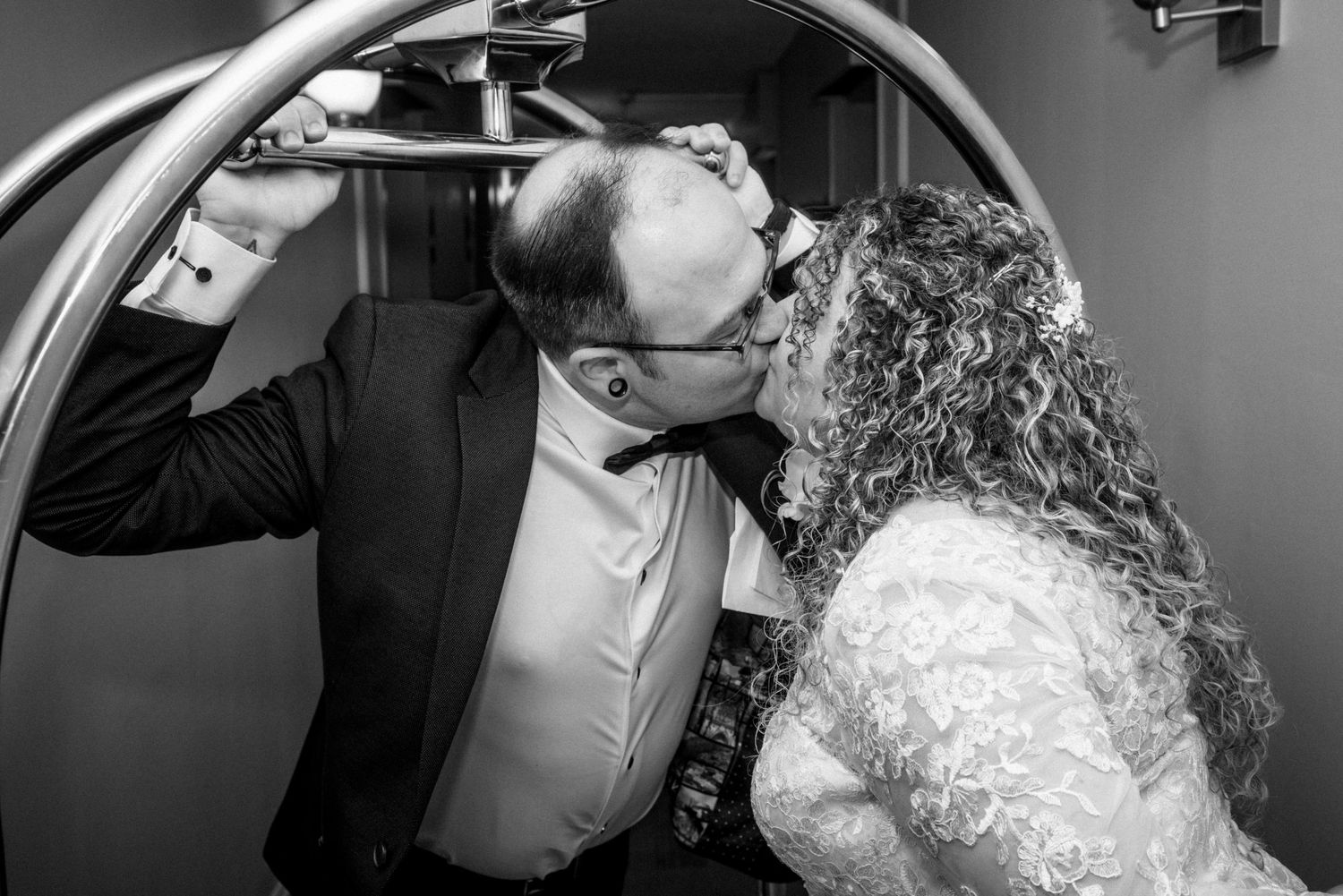 Black and white portrait of couple sharing intimate moment.