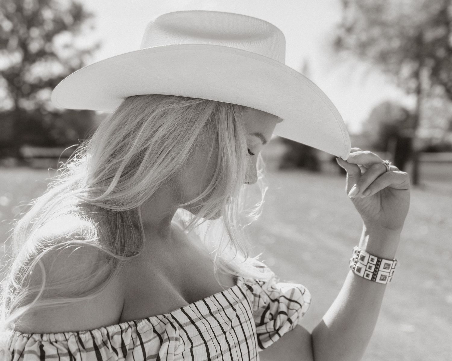 Series of dreamy black and white shots featuring a white cowboy hat.