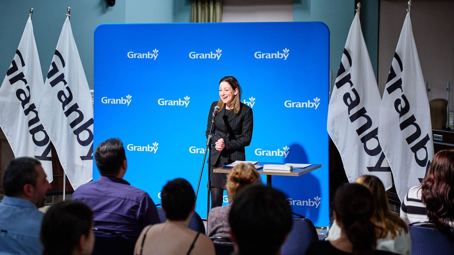Corporate event setup with blue Granby branded banners and displays.