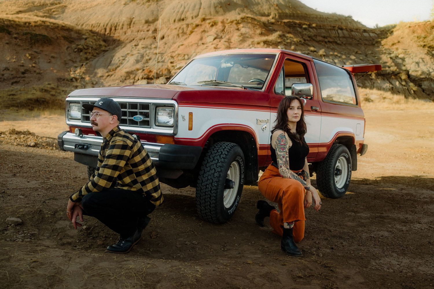 Multiple views of classic trucks parked in a desert setting during golden hour.