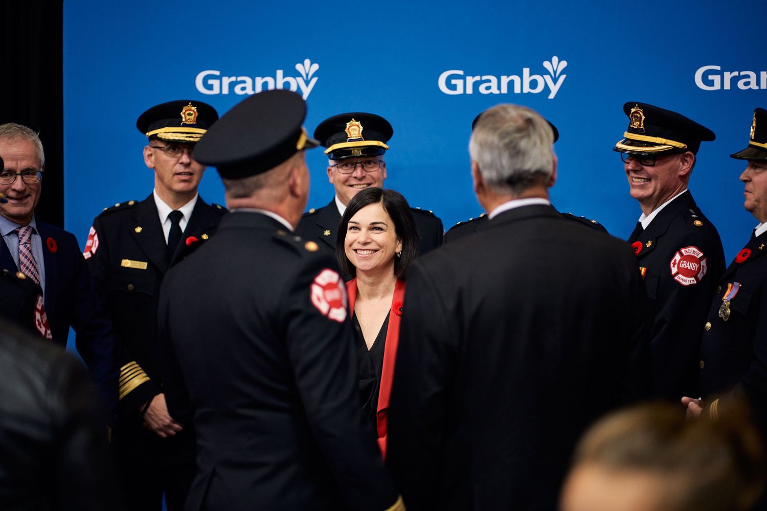 Official gathering with uniformed personnel at a Granby branded event.