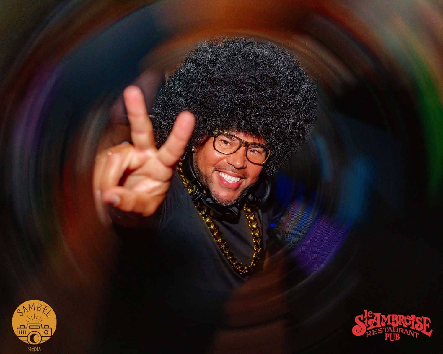 Fun portrait with colorful swirled background effect and peace sign gesture.