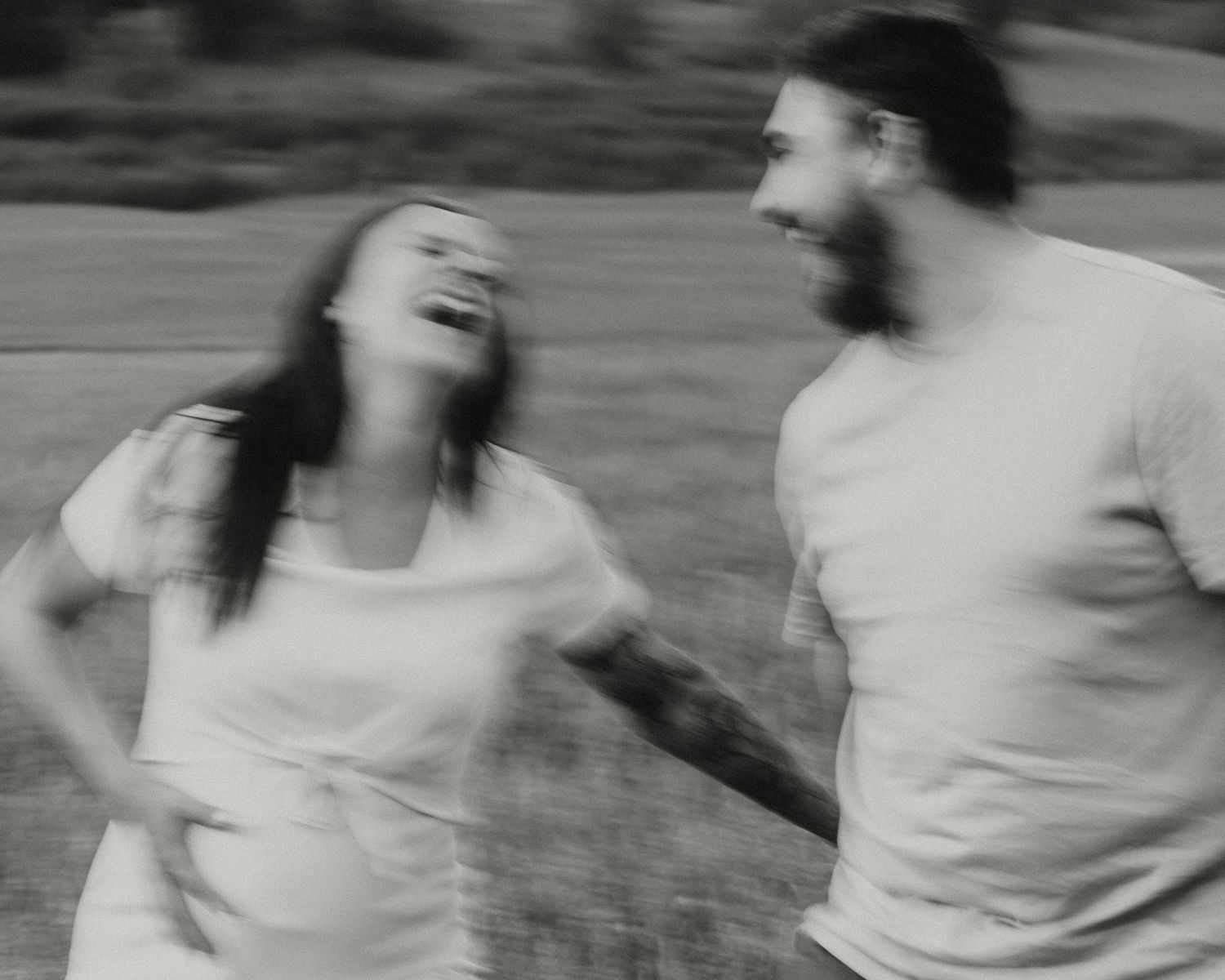 Black and white sequence showing playful movement and laughter.
