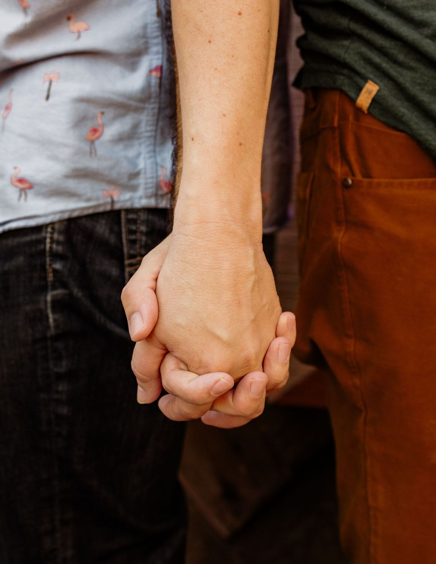 Close-up shots of hands clasped together showing growing intimacy.