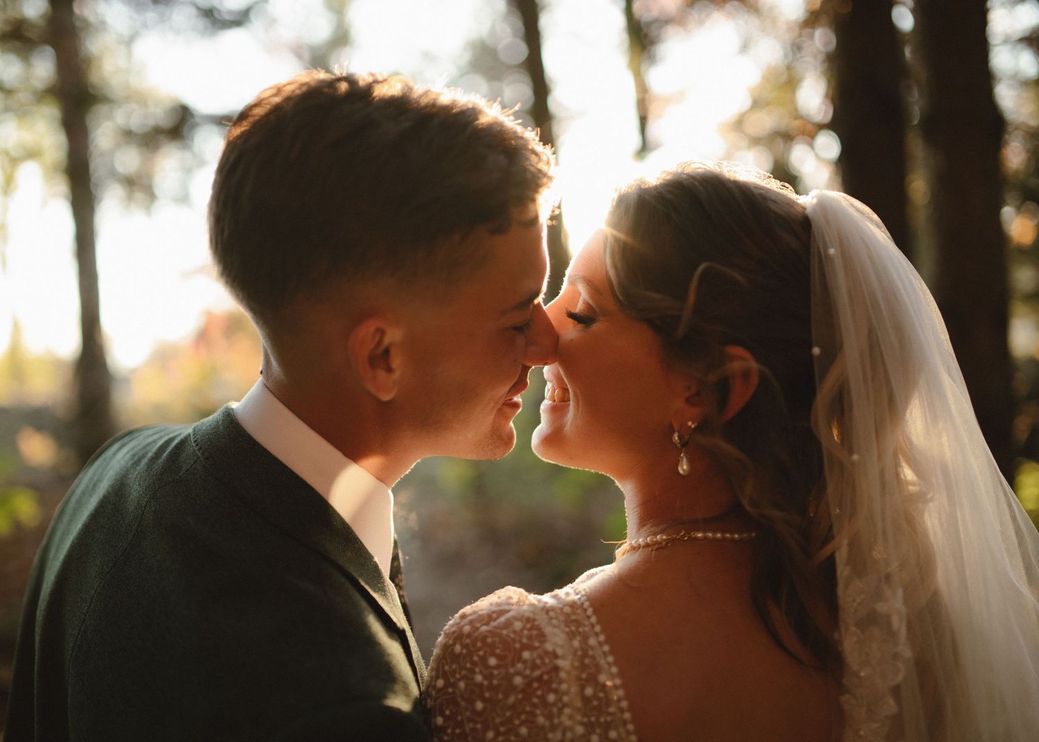 Romantic sunset wedding portraits captured in warm golden light.