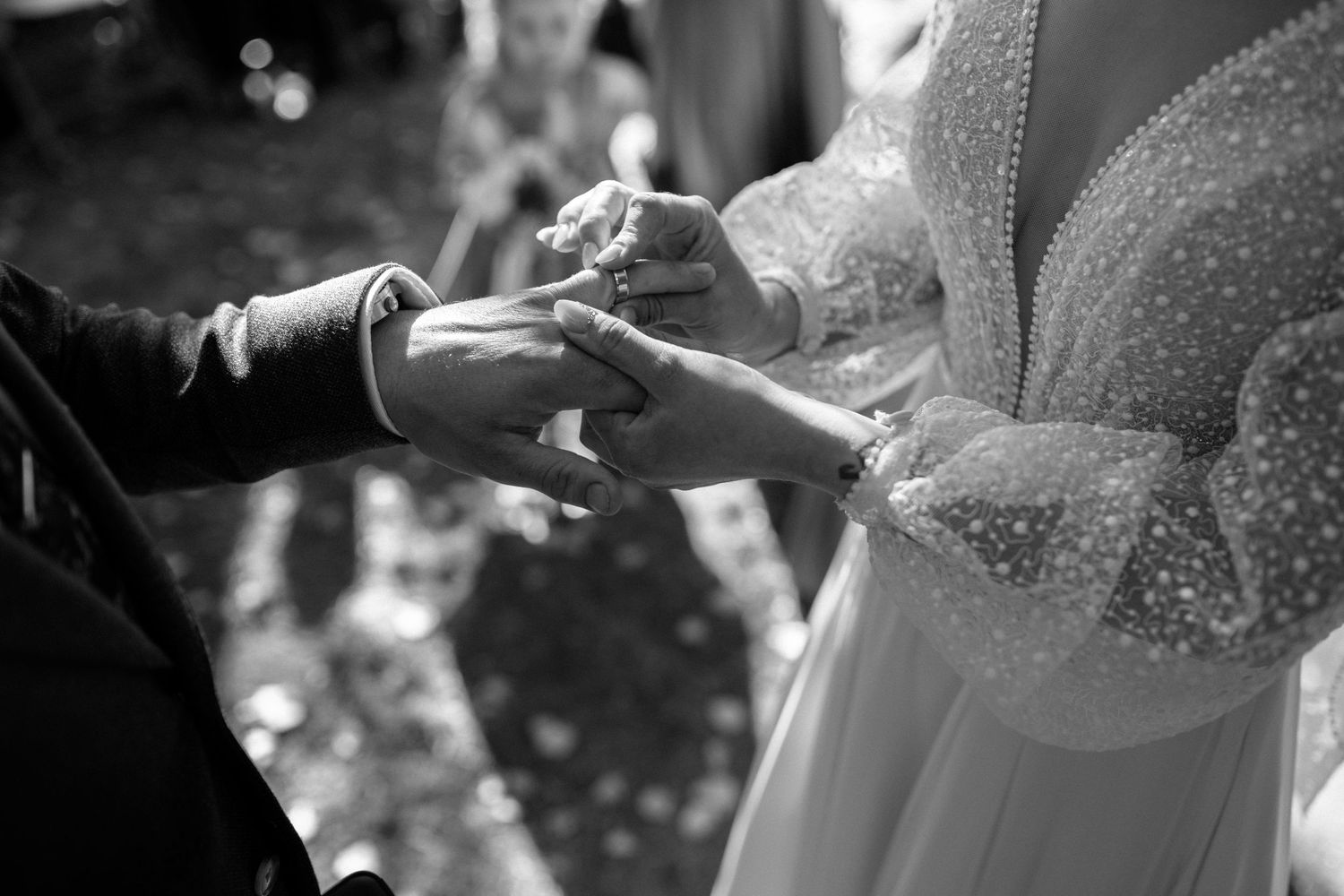 Close-up details of a beaded wedding dress bodice in natural light.