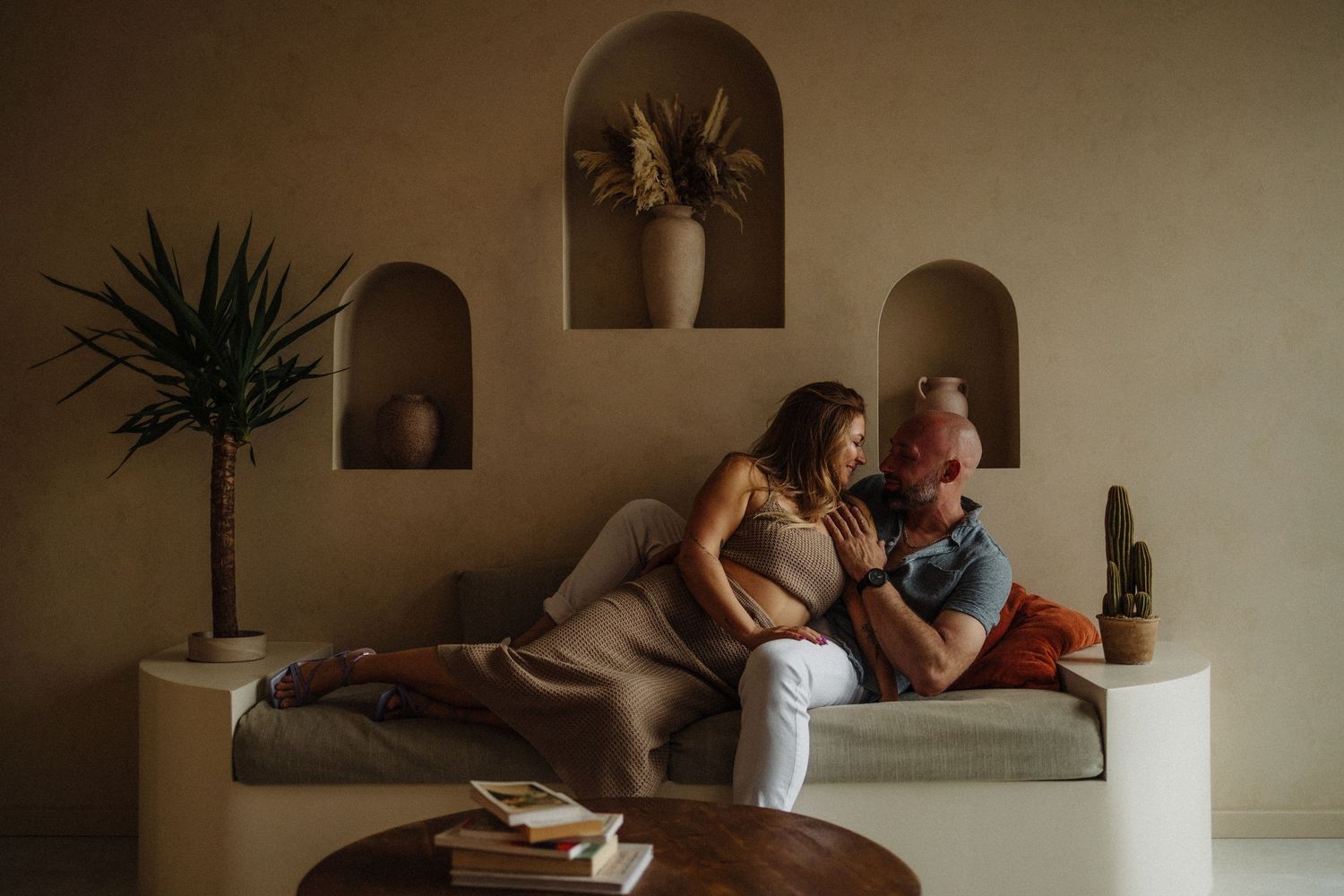 Intimate indoor photographs with soft lighting and minimalist decor.