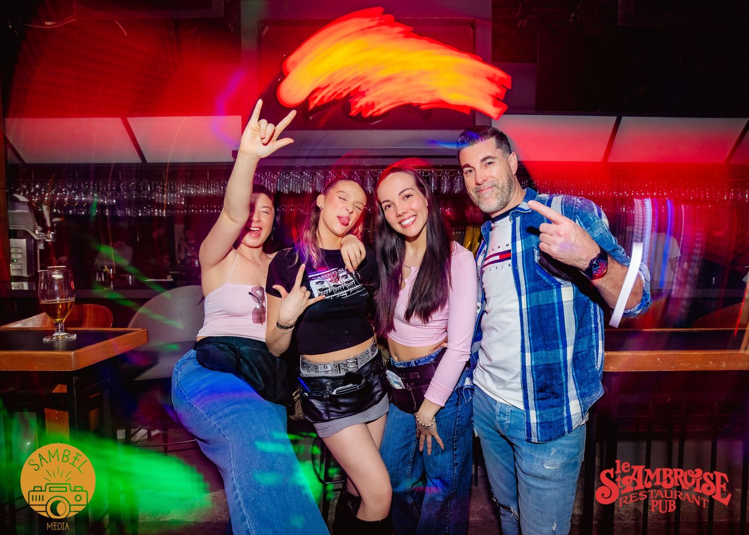 Nightclub scene bathed in vibrant red and green lighting effects.