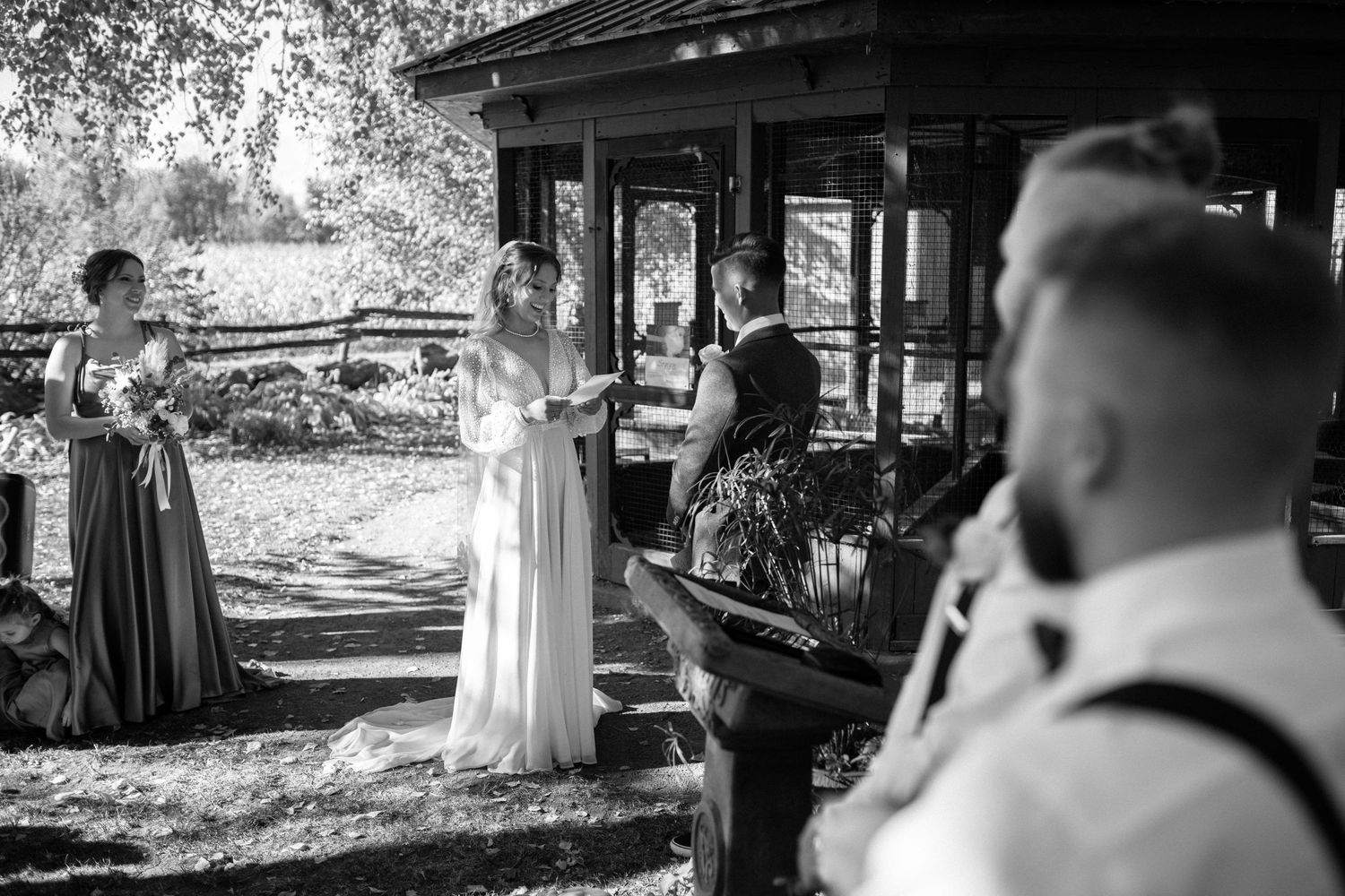 Black and white wedding ceremony photos showing intimate moments between couple.
