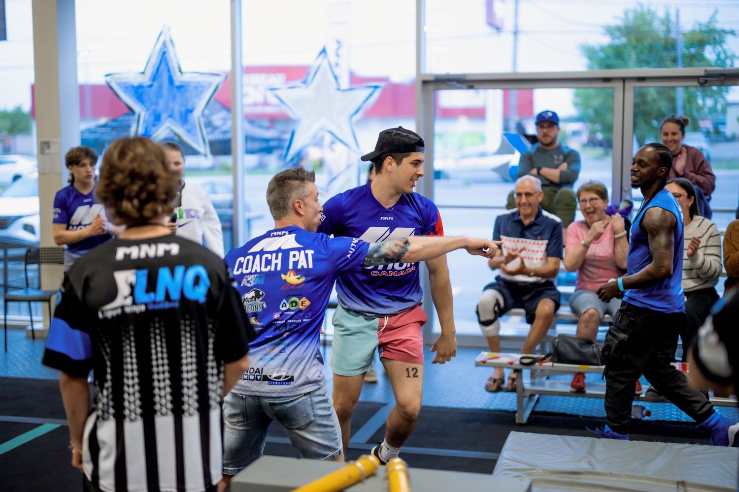 People participating in group activities with star decorations visible in the background.