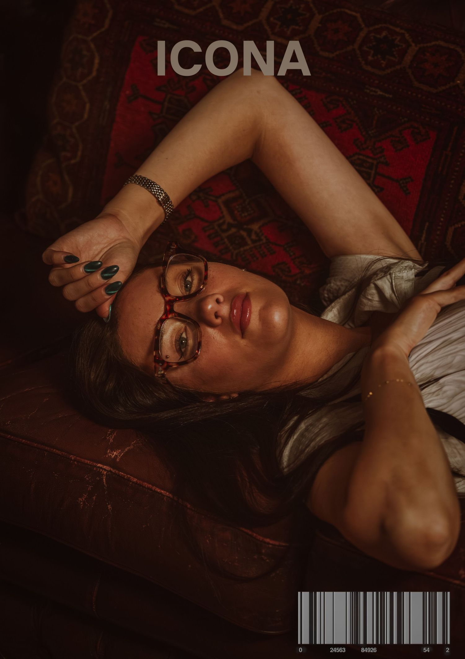 Artistic boudoir photography with dark red tones and dramatic lighting.
