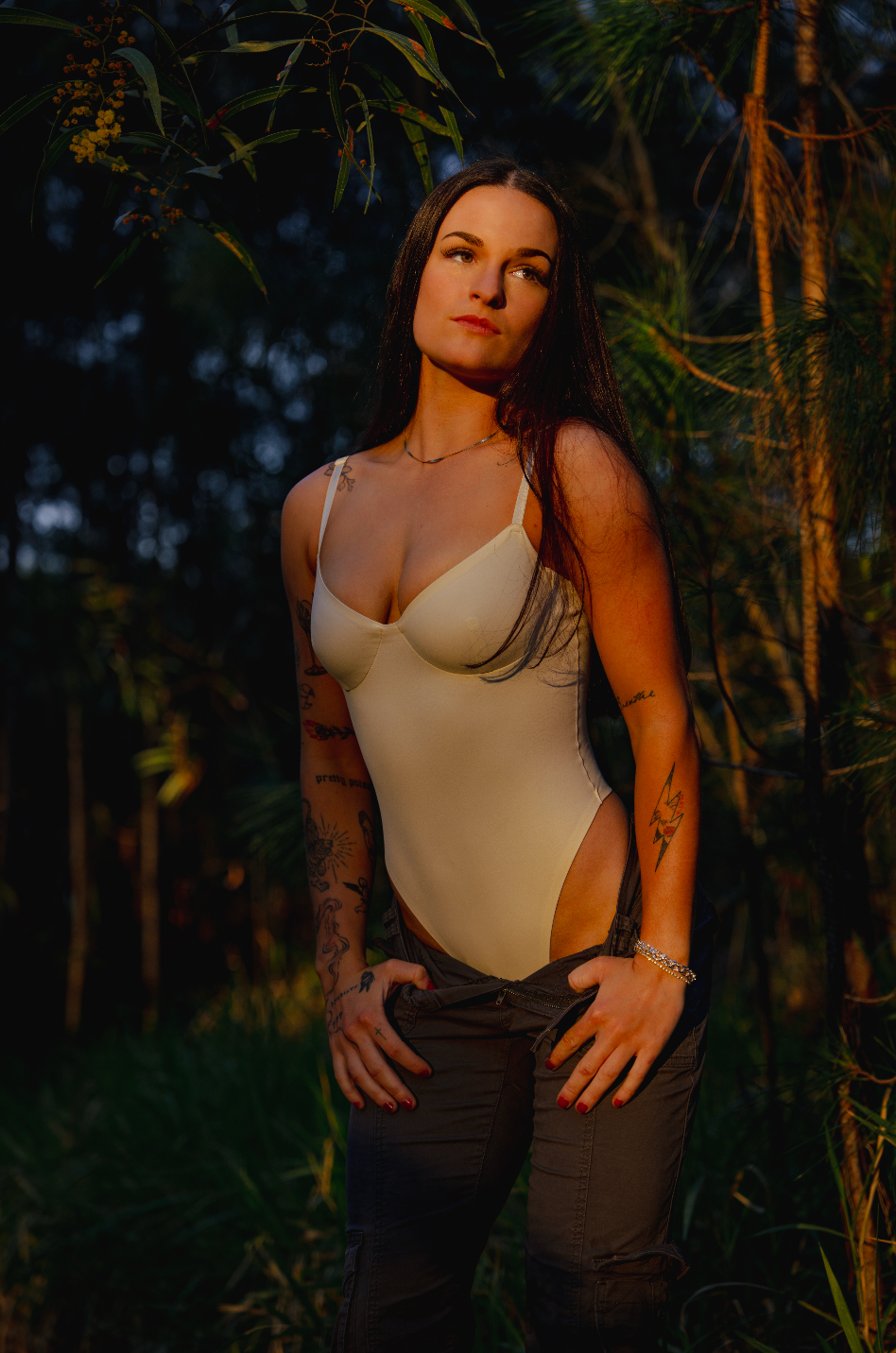 Fashion portraits in a forest setting during sunset featuring casual summer attire.