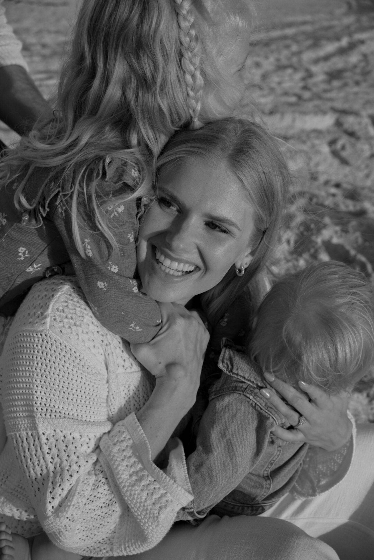 Intimate black and white portrait of people sharing a joyful moment together.