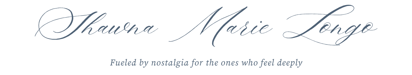 Elegant cursive script logo for Shawna Marie Longe with tagline Fueled by nostalgia for the ones who feel deeply.