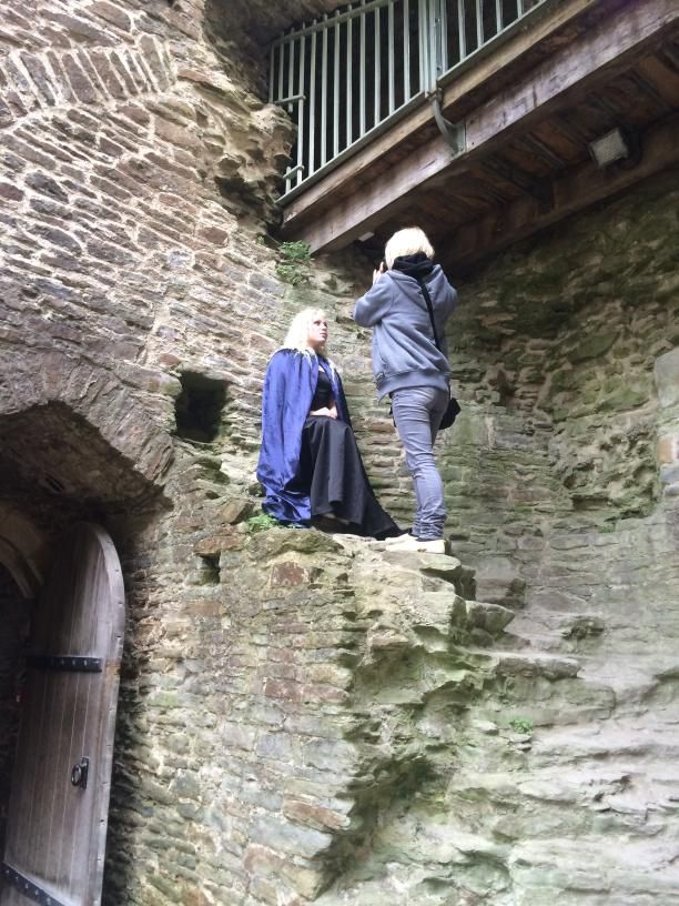 Photographer taking a photograph of model at Castle Coch, Cardiff.